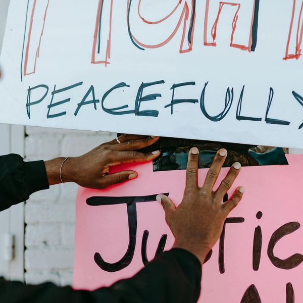 Person meditating peacefully with a calm expression.